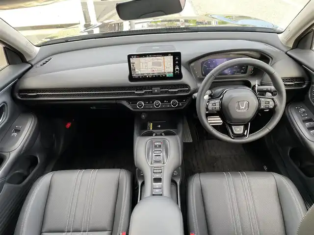 ホンダ ＺＲ－Ｖ ハイブリッド e:HEV Z 東京都 2025(令7)年 0.1万km クリスタルブラックパール 純正９型ワイドディスプレイナビ＆フルセグ　/・BluetoothAudio&USB/・AppleCarPlay&AndroidAuto/アラウンドビューモニター　/ブラインドスポットモニター　/ＢＯＳＥサウンドシステム　/ハンズフリーパワーバックドア　/ステアリングヒーター　/ワイヤレス充電　/レーダークルーズコントロール/レーザーパワーシート/・前席シートヒーター/・前席パワーシート/・リア左右席シートヒーター/・２列目パーソナルUSB/パーキングセンサーシステム/ホンダセンシング/（安全運転支援システム）/・衝突軽減ブレーキ/・歩行車事故低減ステアリング/・車線維持支援システム/・先行車発進お知らせ機能/保証書＆取説