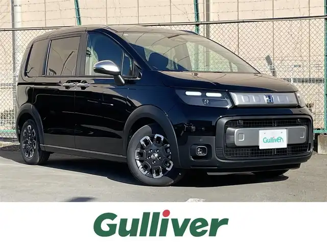 ホンダ フリード ハイブリット e:HEV クロスター 東京都 2025(令7)年 0.1千km クリスタルブラックパール 登録済未使用車　/ホンダセンシング　/純正９型ナビ　LXM-242ZFNI(207680円)/リアクーラー　/両側電動ドア　/ハーフレザー　/シートヒーター　/フルセグＴＶ　/ルーフレール　/ＬＥＤヘッド　/フォグランプ　/純正１５インチＡＷ　/BSM