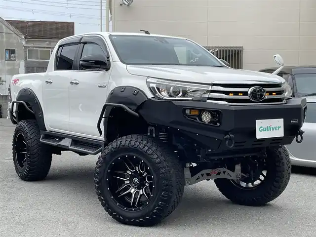 トヨタ ハイラックス Z 和歌山県 2018(平30)年 6.9万km スーパーホワイトⅡ JAOS BATTLESリフトアップキット/BTVメンバーダウンキット/ＧＩＧＥＡＲフロントバンパー/社外サイドステップ/社外SDナビ/CD/DVD/BT/フルセグTV/ETC/バックカメラ/クルコン/レーンキープアシスト/衝突軽減システム/横滑り防止装置/盗難防止装置/社外エアロ(FSR)/LEDヘッドライト/オートライト/ダウンヒルアシストコントロール/エンジンスタートボタン/スマートキー/純正フロアマット/社外アルミホイール