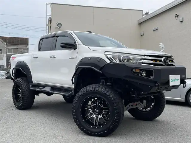 トヨタ ハイラックス Z 和歌山県 2018(平30)年 6.9万km スーパーホワイトⅡ JAOS BATTLESリフトアップキット/BTVメンバーダウンキット/ＧＩＧＥＡＲフロントバンパー/社外サイドステップ/社外SDナビ/CD/DVD/BT/フルセグTV/ETC/バックカメラ/クルコン/レーンキープアシスト/衝突軽減システム/横滑り防止装置/盗難防止装置/社外エアロ(FSR)/LEDヘッドライト/オートライト/ダウンヒルアシストコントロール/エンジンスタートボタン/スマートキー/純正フロアマット/社外アルミホイール