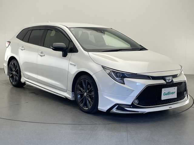 トヨタ カローラツーリング ハイブリッド ダブルバイビー 宮崎県 2020(令2)年 4.6万km ホワイトパールクリスタルシャイン モデリスタフルエアロ/Toyota Safety Sense/〇プリクラシュセーフティ/〇レーントレーシングアシスト/〇ブラインドスポットモニター/〇リアクロストラフィックアラート/〇パーキングサポートブレーキ/〇ロードサインアシスト/〇クリアランスソナー/〇オートマチックハイビーム/〇レーダークルーズコントロール/〇先行車発進告知/純正9インチディスプレイオーディオ/ナビ機能/バックカメラ/ハーフレザーシート/LEDヘッドライト/ビルトインETC/純正17インチAW/前後ドライブレコーダー