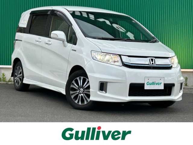 ホンダ フリード スパイク ハイブリット ジャストセレクション 宮城県 2015(平27)年 8.4万km ホワイトオーキッドパール ワンオーナー/純正SDナビ/【CD・DVD・SD・BT・フルセグTV】/バックカメラ/両側パワースライドドア/クルーズコントロール/純正エアロ/純正15インチAW/社外ドライブレコーダー/ハーフレザーシート/電動格納ミラー/ウィンカーミラー/オートライト/HIDヘッドライト/横滑り防止装置/ステアリングスイッチ/スマートキー/ETC