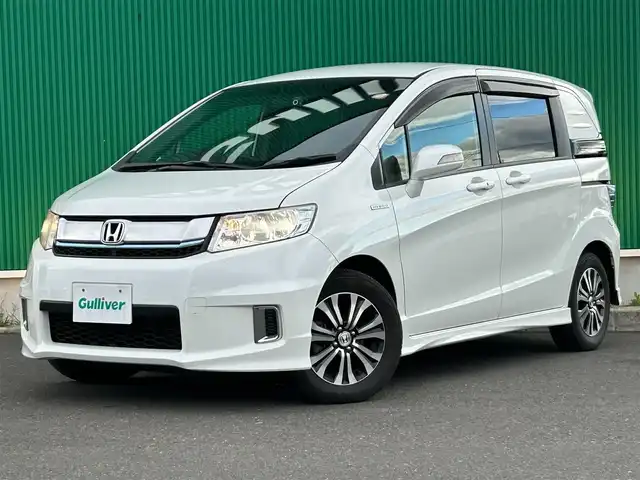 ホンダ フリード スパイク ハイブリット ジャストセレクション 宮城県 2015(平27)年 8.4万km ホワイトオーキッドパール ワンオーナー/純正SDナビ/【CD・DVD・SD・BT・フルセグTV】/バックカメラ/両側パワースライドドア/クルーズコントロール/純正エアロ/純正15インチAW/社外ドライブレコーダー/ハーフレザーシート/電動格納ミラー/ウィンカーミラー/オートライト/HIDヘッドライト/横滑り防止装置/ステアリングスイッチ/スマートキー/ETC