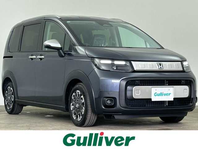 ホンダ フリード ハイブリット e:HEV クロスター 千葉県 2025(令7)年 0.1千km メテオロイドグレーメタリック 登録済未使用車/登録時走行距離：4km/純正９型ナビ/AM＆FM＆Bluetooth＆フルセグTV＆AppleCarPlay/ホンダセンシング/衝突軽減ブレーキ/両側電動スライドドア　/レーダークルーズコントロール　/後席クーラー　/ブラインドスポットモニター　/ハーフレザーシート/シートヒーター/ルーフレール/LEDヘッドライト/フォグランプ/電動格納サイドミラー/電動パーキングブレーキ/USBポート/12Vシガーソケット/ステアリングスイッチ/バックカメラ/アイドリングストップ/ウィンカーミラー/プッシュスタート