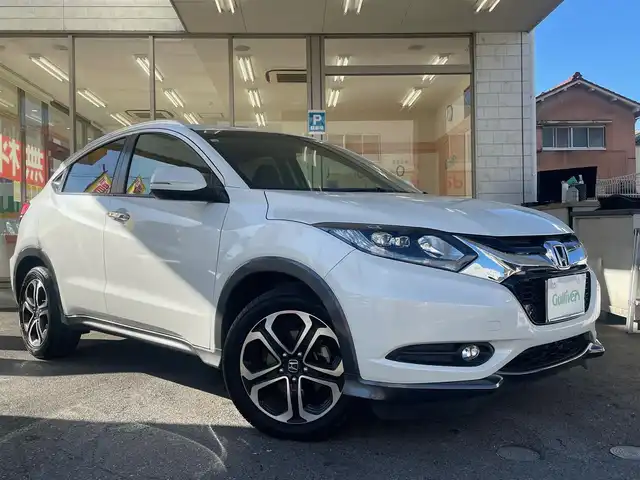 ホンダ ヴェゼル S 愛知県 2015(平27)年 5万km ホワイトオーキッドパール /当店買取/禁煙/1オーナー//純正ナビVXM-152VFi//フルセグTV/CD/DVD/SD/USB/Bluetooth//CTBA/LEDヘッド/Aライト//パドルシフト//あんしんパッケージ/ナビ装着SPパッケージ/コンフォートビューパッケージ//スタイリッシュパッケージ//ハーフレザー/シートヒーター//ISOFIX/純正Fマット//Aストップ/革巻きステアリング/クルコン//ブレーキホールド//保証書/取説/スペアキー