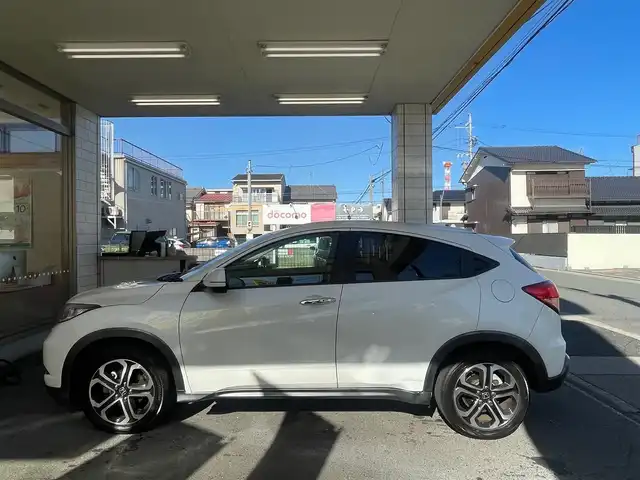 ホンダ ヴェゼル S 愛知県 2015(平27)年 5万km ホワイトオーキッドパール /当店買取/禁煙/1オーナー//純正ナビVXM-152VFi//フルセグTV/CD/DVD/SD/USB/Bluetooth//CTBA/LEDヘッド/Aライト//パドルシフト//あんしんパッケージ/ナビ装着SPパッケージ/コンフォートビューパッケージ//スタイリッシュパッケージ//ハーフレザー/シートヒーター//ISOFIX/純正Fマット//Aストップ/革巻きステアリング/クルコン//ブレーキホールド//保証書/取説/スペアキー