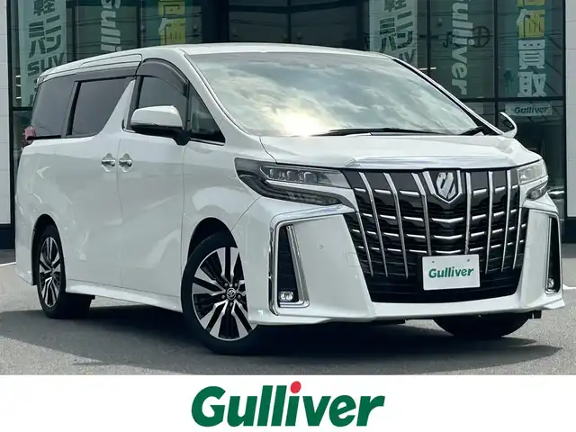 トヨタ アルファード S Cパッケージ 岡山県 2020(令2)年 7.9万km ホワイトパールクリスタルシャイン ALPINE10インチナビ/フルセグTV(AM.FM.CD.DVD.TV.BT)/バックカメラ/ALPINE12.8インチフリップダウンモニター/ビルトインETC/前後ドライブレコーダー/両側パワースライドドア/前席シートヒーター/前席ベンチレーション/D席メモリーシート/前席パワーシート/パワーバックドア/デジタルインナーミラー/ブラインドスポットモニター/レーダークルーズコントロール/トヨタセーフティセンス/・レーントレーシングアシスト/・パーキングサポートブレーキ/・プリクラッシュセーフティ/・インテリジェントクリアランスソナー/・ロードサインアシスト/・オートマチックハイビーム/ロールサンシェード/AC100V