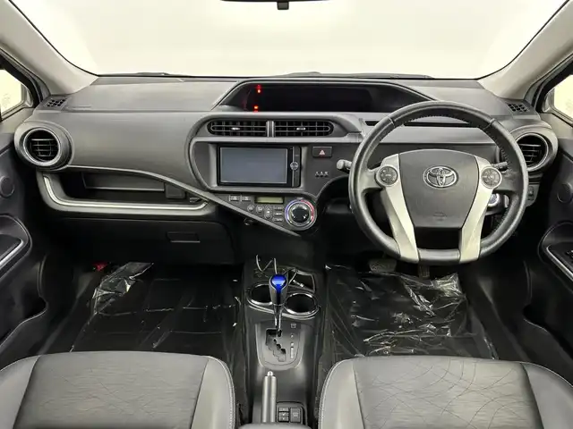 トヨタ アクア G ブラックソフトレザーセレ 埼玉県 2013(平25)年 10.4万km ライムホワイトパールクリスタルシャイン 純正ナビ　NSZT-W62G　バックカメラ　Ｂｌｕｅｔｏｏｔｈ　フルセグＴＶ　合皮シート　シートヒーター　エアロ　純正１５インチＡＷ　ＥＴＣ　オートライト　　キセノン　フォグランプ　スマートキー　プッシュスタート