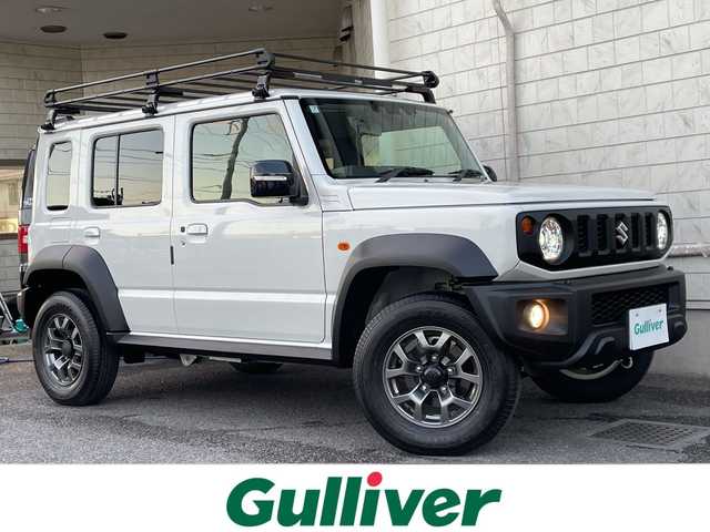 スズキ ジムニー ノマド FC 神奈川県 2025(令7)年 0.5万km アークティックホワイトパール ワンオーナー/アンドロイドナビ(AM/FM/BT/Googleナビ)/バックカメラ/ルーフキャリア/リアラダー/衝突被害軽減ブレーキ/レーンキープアシスト/横滑り防止装置/パーキングセンサー/ダウンヒルアシストコントロール/レーダークルーズコントロール/アイドリングストップキャンセラー/D/N席シートヒーター/ミラーヒーター/ETC/前方ドライブレコーダー/ISOFIX/スペアキー×1/保証書/取扱説明書
