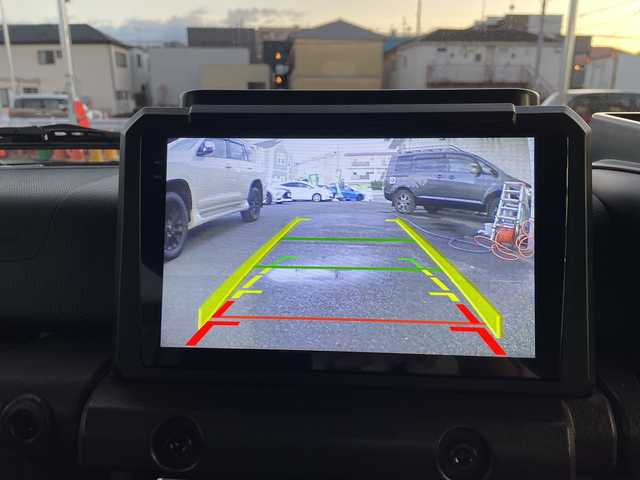 スズキ ジムニー ノマド FC 神奈川県 2025(令7)年 0.5万km アークティックホワイトパール ワンオーナー/アンドロイドナビ(AM/FM/BT/Googleナビ)/バックカメラ/ルーフキャリア/リアラダー/衝突被害軽減ブレーキ/レーンキープアシスト/横滑り防止装置/パーキングセンサー/ダウンヒルアシストコントロール/レーダークルーズコントロール/アイドリングストップキャンセラー/D/N席シートヒーター/ミラーヒーター/ETC/前方ドライブレコーダー/ISOFIX/スペアキー×1/保証書/取扱説明書