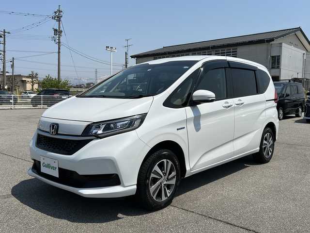 ホンダ フリード＋ ハイブリット G ホンダセンシング 富山県 2022(令4)年 4万km プラチナホワイトパール ・4WD/・ワンオーナー/・寒冷地仕様/・純正ナビ/・ワンセグ/BT/CD/・バックカメラ/・シートヒーター/・両側パワースライド/・ホンダセンシング/・アダプティブクルーズコントロール/・レーンキープアシスト/・クリアランスソナー/・アイドリングストップ/・横滑り防止装置/・ビルトインETC/・オートライト/・LEDヘッドライト/・スマートキー/・プッシュスタート