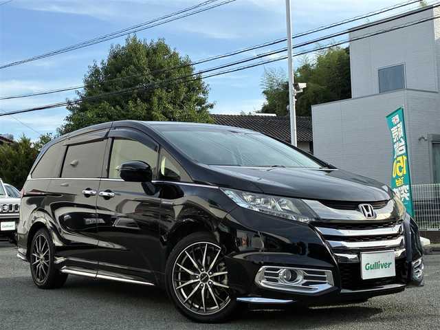 ホンダ オデッセイ ハイブリッド アブソルートセンシングEXパック 熊本県 2016(平28)年 9.9万km クリスタルブラックパール 純正ナビ（VXM-175VFEi）/【フルセグTV/Bluetooth/CD/DVD】/バックカメラ/フリップダウンモニター/両側パワースライドドア/クルーズコントロール/衝突軽減防止装置/レーンキープ/ブラインドスポットモニター/パワーシート/純正18インチAW/純正ドアバイザー/革巻きステアリング/ステアリングスイッチ/オートLEDライト/ウィンカーミラー/ドライブレコーダー/ETC/プッシュスタート/スマートキー/横滑り防止装置/ABS/盗難防止装置/保証書