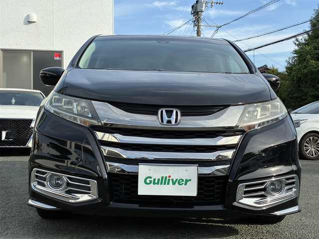 ホンダ オデッセイ ハイブリッド アブソルートセンシングEXパック 熊本県 2016(平28)年 9.9万km クリスタルブラックパール 純正ナビ（VXM-175VFEi）/【フルセグTV/Bluetooth/CD/DVD】/バックカメラ/フリップダウンモニター/両側パワースライドドア/クルーズコントロール/衝突軽減防止装置/レーンキープ/ブラインドスポットモニター/パワーシート/純正18インチAW/純正ドアバイザー/革巻きステアリング/ステアリングスイッチ/オートLEDライト/ウィンカーミラー/ドライブレコーダー/ETC/プッシュスタート/スマートキー/横滑り防止装置/ABS/盗難防止装置/保証書