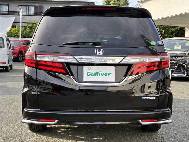 ホンダ オデッセイ ハイブリッド アブソルートセンシングEXパック 熊本県 2016(平28)年 9.9万km クリスタルブラックパール 純正ナビ（VXM-175VFEi）/【フルセグTV/Bluetooth/CD/DVD】/バックカメラ/フリップダウンモニター/両側パワースライドドア/クルーズコントロール/衝突軽減防止装置/レーンキープ/ブラインドスポットモニター/パワーシート/純正18インチAW/純正ドアバイザー/革巻きステアリング/ステアリングスイッチ/オートLEDライト/ウィンカーミラー/ドライブレコーダー/ETC/プッシュスタート/スマートキー/横滑り防止装置/ABS/盗難防止装置/保証書