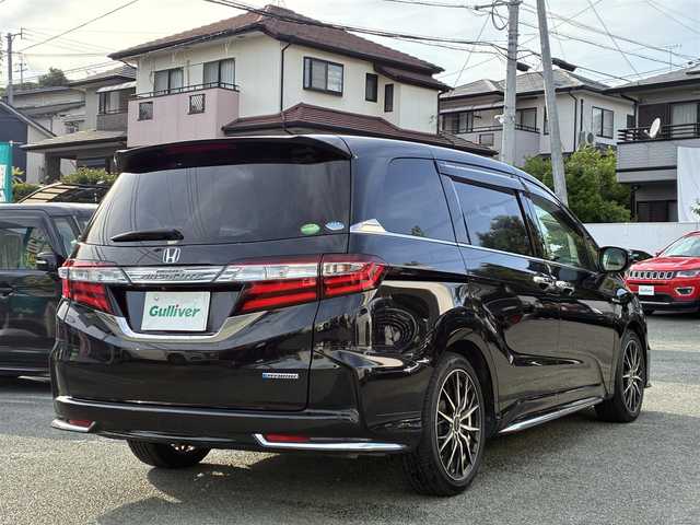 ホンダ オデッセイ ハイブリッド アブソルートセンシングEXパック 熊本県 2016(平28)年 9.9万km クリスタルブラックパール 純正ナビ（VXM-175VFEi）/【フルセグTV/Bluetooth/CD/DVD】/バックカメラ/フリップダウンモニター/両側パワースライドドア/クルーズコントロール/衝突軽減防止装置/レーンキープ/ブラインドスポットモニター/パワーシート/純正18インチAW/純正ドアバイザー/革巻きステアリング/ステアリングスイッチ/オートLEDライト/ウィンカーミラー/ドライブレコーダー/ETC/プッシュスタート/スマートキー/横滑り防止装置/ABS/盗難防止装置/保証書