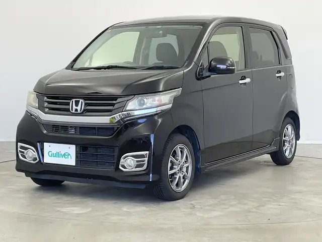 ホンダ Ｎ ＷＧＮ カスタム G 新潟県 2014(平26)年 6.9万km プレミアムゴールドパープルパール 純正メモリナビ（Bluetooth・CD・DVD）/地デジ　/キセノンオートライト　/前方ドライブレコーダー/ETC　/レザーステアリング　/フォグランプ　/電格ウィンカーミラー　/純正フロアマット　/社外１４インチアルミホイール/保証書　/取扱説明書/ECON　/スマートキー/スペアキー