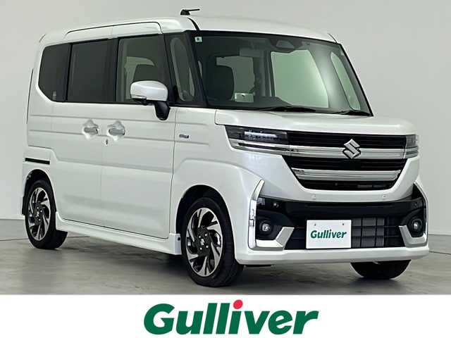 スズキ スペーシア カスタム HYBRID XS 岐阜県 2024(令6)年 1万km ピュアホワイトP スズキセーフティサポート/デュアルセンサーブレーキサポートII/ハイビームアシスト/アダプティブクルーズコントロール/レーンキープアシスト/コーナーセンサー/純正9インチナビ/　(AM/FM/Bluetooth/フルセグTV/AppleCarPlay)/全方位カメラ/ヘッドアップディスプレイ/両側パワースライドドア/ハーフレザーシート/シートヒーター/ステアリングヒーター/LEDヘッドライト/純正アルミホイール/スペアキー