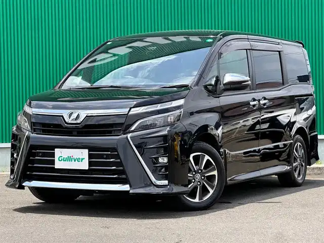 トヨタ ヴォクシー ZS 煌Ⅱ 宮城県 2019(平31)年 6.8万km ブラック Toyota Safety Sense /・プリクラッシュセーフティ/・レーンディパーチャーアラート/・オートマチックハイビーム/・発進遅れ告知機能/インテリジェントクリアランスソナー/12.1フリップダウンモニター（V12T-R66C）/純正9インチナビ【NSZT-Y66T】/・CD/DVD/・フルセグTV/・Bluetooth/・USB/ビルトインETC/両側パワースライドドア /LEDヘッドライト/フォグランプ/オートライト/革巻きステアリング/クルーズコントロール/ステアリングスイッチ/ウィンカー付電動格納式ミラー/純正16インチAW/純正フロアマット/純正ドアバイザー/Wエアバッグ/保証書