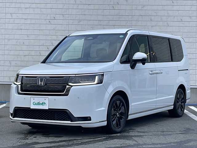 ホンダ ステップワゴン スパーダ eHEV 山形県 2022(令4)年 5.5万km プラチナホワイトパール 禁煙車/ワンオーナー/Honda SENSING/・衝突軽減ブレーキ（ＣＭＢＳ）/・路外逸脱抑制機能/・先行車発進お知らせ機能/・アダプティブクルーズコントロール（ＡＣＣ）/・車線維持支援システム（ＬＫＡＳ）/・標識認識機能/・誤発進抑制機能 /・近距離衝突軽減ブレーキ/ブラインドスポットモニター/両側パワースライドドア/純正11.4インチナビ/（CD.DVD.BT.SD.USB）/フルセグ/バックカメラ/ハーフレザーシート/パドルシフト/シートヒーター/電動パーキングブレーキ/オートホールド/タイプC急速充電ポート/ドライブレコーダー/ETC