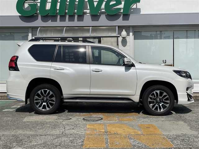 トヨタ ランドクルーザー プラド TX Lパッケージ 神奈川県 2022(令4)年 2.3万km ホワイトパールクリスタルシャイン アルパインメモリナビ　/　（CD・DVD・Bluetooth・HDMI）/フルセグTV/電動ムーンルーフ/モデリスタフロントスポイラー/モデリスタリヤスカート/ベージュレザーシート/シートヒーター/エアシート/トヨタセーフティセンス/レーダークルーズコントロール/ルーフレール/純正OP19インチAW/LEDヘッドライト/LEDフォグライト/バックカメラ/前席パワーシート/クリアランスソナー/スマートキー×2/保証書/取扱説明書