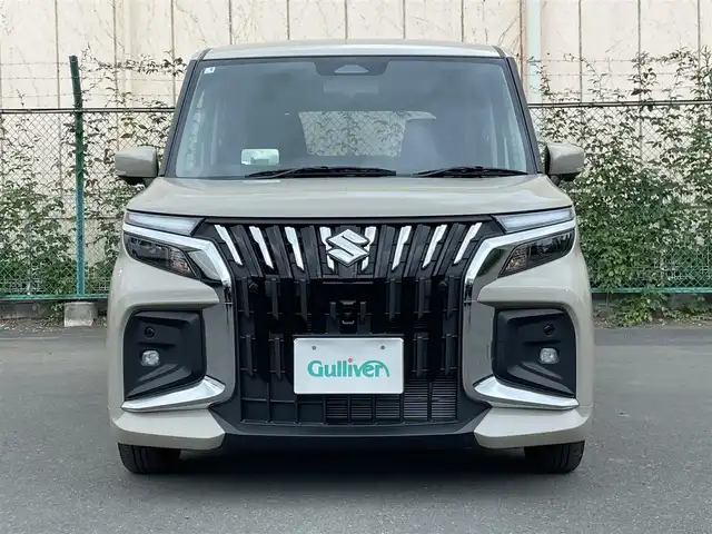 スズキ ソリオ バンディット HV MV 東京都 2025(令7)年 0.1万km キャラバンアイボリーPM 全方位モニター付メモリーナビゲーション/（9インチ、HUD、TV、BT、DVD、CD、FM、AM）/両側パワスラ/ＨＵＤ（マルチインフォメーションディスプレイ）/セーフティーサポート/ＡＣＣ/F席シートヒーター（ファブリックシート）/コーナーセンサー/ＡｐｐｌｅＣａｒＰｌａｙ/ＡｎｄｒｏｉｄＡｕｔｏ/オートＬＥＤヘッドランプ/LED[ポジションランプ/革巻きステアリング/ステアリングスイッチ/横滑り防止/レーンキープＡ/衝突被害軽減システム/フロントエアロバンパー/リアエアロバンパー/キーレスプッシュスタートシステム/アクセサリーソケット（USB電源ソケット）