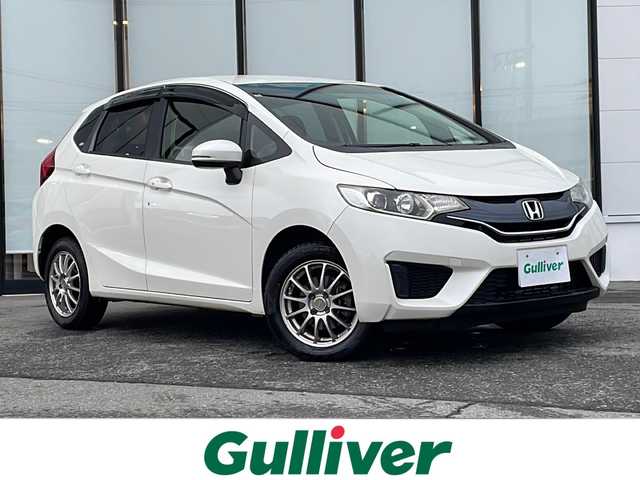 ホンダ フィット 13G Lパッケージ 山形県 2014(平26)年 10万km プレミアムホワイトパール 禁煙車/4WD/寒冷地仕様/横滑り防止装置/社外SDナビ/（Bluetooth/CD/DVD/フルセグ)/バックカメラ/LEDオートライト/ステアリングスイッチ/ETC/社外AW/純正フロアマット/電動格納ウィンカーミラー/スマートキー×2/エンジンスターター/ドアバイザー