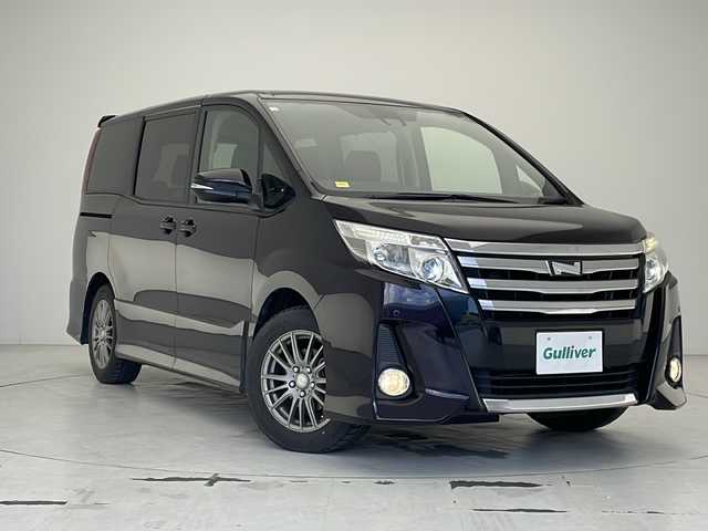 トヨタ ノア Si 沖縄県 2016(平28)年 5.6万km ボルドーマイカメタリック ワンオーナー/純正ナビ【NSZT-W64】/　（CD/DVD/Bluetooth/DTV）/バックカメラ/ビルドインETC/片側パワースライドドア/TOYOTA　safety sense /ステアリングスイッチ/サンシェード/MTモード付AT/電動格納ウインカーミラー/クリアランスソナー/純正フロアマット/LEDヘッドライト/オートライト/取扱説明書/保証書