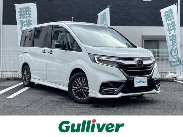ホンダ ステップワゴン eHEVモデューロX ホンダS 三重県 2020(令2)年 5万km プラチナホワイトパール 登録時49297km/禁煙車/ハーフレザーシート/純正フリップダウンモニター/純正10インチナビ/（AM/FM/TV/Bluetooth/CD/DVD/HDMI）/フルセグTV/バックカメラ/ビルトインETC2.0/純正ドライブレコーダー/レーダークルーズコントロール/ステアリングスイッチ/パドルシフト/オートライト/両側パワースライドドア/シートヒーター/衝突軽減システム/レーンキープアシスト/コーナーセンサー/プッシュスタート/純正フロアマット/純正アルミ/スペアキー