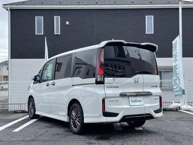 ホンダ ステップワゴン eHEVモデューロX ホンダS 三重県 2020(令2)年 5万km プラチナホワイトパール 登録時49297km/禁煙車/ハーフレザーシート/純正フリップダウンモニター/純正10インチナビ/（AM/FM/TV/Bluetooth/CD/DVD/HDMI）/フルセグTV/バックカメラ/ビルトインETC2.0/純正ドライブレコーダー/レーダークルーズコントロール/ステアリングスイッチ/パドルシフト/オートライト/両側パワースライドドア/シートヒーター/衝突軽減システム/レーンキープアシスト/コーナーセンサー/プッシュスタート/純正フロアマット/純正アルミ/スペアキー