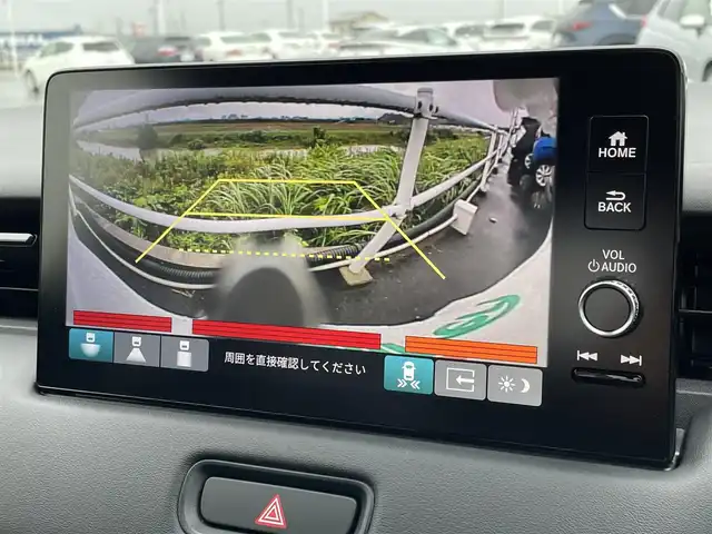 ホンダ ヴェゼル ハイブリッド e:HEV Z 佐賀県 2025(令7)年 0.1万km未満 プラチナホワイトパール 登録時走行距離5km/登録済未使用車/9型 Honda CONNECTディスプレ－オーディオ/・AppleCarPlay AndroidAuto/・Bluetooth フルセグTV USB/バックカメラ/ETC2.0/パワーバックドア/革巻きステアリング/ステアリングリモコン/ステアリングヒーター/シートヒーター/純正LEDヘッドライト/アダプティブドライビングビーム/MTモード付AT/電子パーキングブレーキ/オートブレーキホールド/純正18インチアルミホイール/スマートキー/スペアキー１本/HondaSENSING/・衝突軽減ブレーキ/・誤発信抑制機能/・車線維持支援システム/・先行車発進お知らせ機能/・路外逸脱抑制機能/・トラフィックジャムアシスト/・渋滞追従機能付きアダプティブクルーズコントロール/・ブラインドスポットインフォメーション