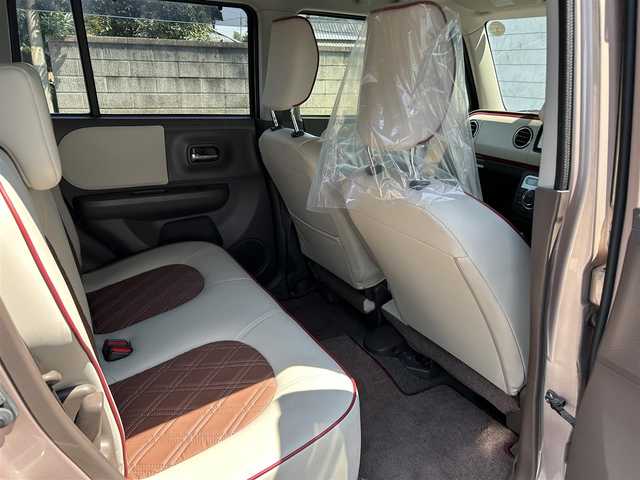 スズキ ラパン ショコラ X 埼玉県 2014(平26)年 7.7万km ピンク 純正ナビオーディオ/（AM/FM/BT/iPod/AUX/SD）/ワンセグテレビ/バックカメラ/アイドリングストップ/ドライブレコーダー前後/スペアキー１本（スマートキー）/プッシュスタード/純正フロアマット/保証書/車両/ナビ 取扱説明書