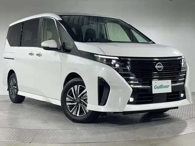 日産 セレナ e－パワー ハイウェイスター V 神奈川県 2023(令5)年 2.2万km プリズムホワイト 9型純正ナビゲーション【MM222D-L】/AM　FM　Bluetooth　フルセグ/11型純正フリップダウンモニター/アラウンドビューモニター/両側パワースライドドア/プロパイロット2.0/追従クルーズコントロール/インテリジェントエマージェンシーブレーキ/衝突回避ステアリングアシスト/電子パーキングブレーキ/オートホールドブレーキ/ビークルダイナミクスコントロール/トラクションコントロールシステム/前方衝突予測警報/先行車発進お知らせ機能/ふらつき警報/標識検知機能/車線逸脱防止支援システム/車線逸脱警報/後側方衝突防止支援システム/後側方車両検知警報/リヤクロストラフィックアラート/デジタルインナーミラー/ビルトインETC/オートライト/ハイビームアシスト/純正16インチアルミホイル