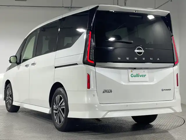 日産 セレナ e－パワー ハイウェイスター V 神奈川県 2023(令5)年 2.2万km プリズムホワイト 9型純正ナビゲーション【MM222D-L】/AM　FM　Bluetooth　フルセグ/11型純正フリップダウンモニター/アラウンドビューモニター/両側パワースライドドア/プロパイロット2.0/追従クルーズコントロール/インテリジェントエマージェンシーブレーキ/衝突回避ステアリングアシスト/電子パーキングブレーキ/オートホールドブレーキ/ビークルダイナミクスコントロール/トラクションコントロールシステム/前方衝突予測警報/先行車発進お知らせ機能/ふらつき警報/標識検知機能/車線逸脱防止支援システム/車線逸脱警報/後側方衝突防止支援システム/後側方車両検知警報/リヤクロストラフィックアラート/デジタルインナーミラー/ビルトインETC/オートライト/ハイビームアシスト/純正16インチアルミホイル