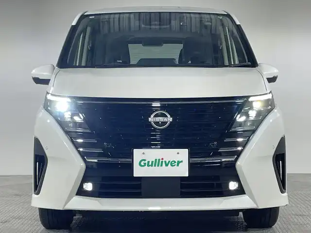 日産 セレナ e－パワー ハイウェイスター V 神奈川県 2023(令5)年 2.2万km プリズムホワイト 9型純正ナビゲーション【MM222D-L】/AM　FM　Bluetooth　フルセグ/11型純正フリップダウンモニター/アラウンドビューモニター/両側パワースライドドア/プロパイロット2.0/追従クルーズコントロール/インテリジェントエマージェンシーブレーキ/衝突回避ステアリングアシスト/電子パーキングブレーキ/オートホールドブレーキ/ビークルダイナミクスコントロール/トラクションコントロールシステム/前方衝突予測警報/先行車発進お知らせ機能/ふらつき警報/標識検知機能/車線逸脱防止支援システム/車線逸脱警報/後側方衝突防止支援システム/後側方車両検知警報/リヤクロストラフィックアラート/デジタルインナーミラー/ビルトインETC/オートライト/ハイビームアシスト/純正16インチアルミホイル