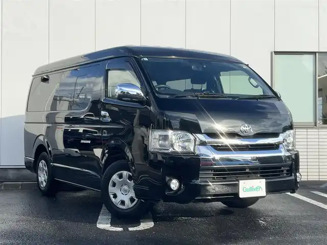 トヨタ ハイエース GL 三重県 2015(平27)年 10.6万km ブラックマイカ フリップダウンモニター/ナビ（Bluetooth/AM/FM/TV/CD/DVD/USB/SD）/バックカメラ/ドライブレコーダー（前）/片側電動スライドドア/イージークローザー（バックドア）/VALENTIテールランプ/オートエアコン/リアクーラー/リアヒーター/AC100V/スペアキー/メッキU字2段フロントグリル/ボディ同色フロントバンパー/フロントフォグランプ/両側メッキドアミラー（電動格納機能付）/メッキアウトサイドドアハンドル/メッキリアナンバープレートガーニッシュ/「GL」エンブレム（バックドア）/ボディ同色リアバンパー/両側固定式リアクォーターガラス/プライバシーガラス/オプティトロンメーター（タコメーター付自発光式アナログメーター）/シルバー加飾付ウレタン製ステアリングホイール/ヘッドレスト別体トリコットシート/シートスライド機構（運転席/助手席）/アームレスト（2/3列目）/スペースアップシート（4列目）/成型スライドドアトリム/ポケット付成型クォータートリム/マップランプ（前席）/大型ルームランプ（後席）