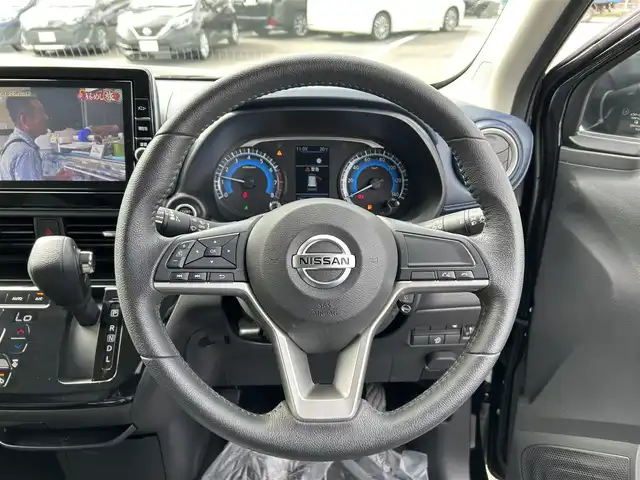 日産 デイズ ハイウェイスターX 愛媛県 2022(令4)年 1.7万km ブラック 純正9型ナビ/バックカメラ/セーフティシールド/衝突被害軽減装置/車線逸脱防止装置/純正ドライブレコーダー/アイドリングストップ/クリアランスソナー/ステアリングリモコン/ヘッドライトレベライザー/純正ドアバイザー/USB充電/オートマチックハイビーム/LEDヘッドライト/ETC/電格ミラー/現状サマー(純正AW)(155/65/R14)/BRIDGESTONE EcoPia EP150/禁煙車