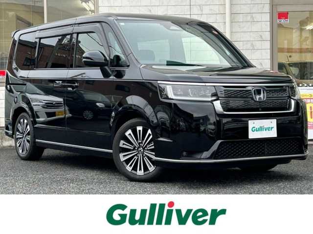 ホンダ ステップワゴン スパーダ eHEV プレミアムライン 福岡県 2023(令5)年 3.1万km クリスタルブラックパール 純正11.4インチメモリナビ/　（AM/FM/CD/DVD/Bluetooth/フルセグTV）/フロント/サイド/バックカメラ/マルチビューカメラシステム/ホンダセンシング/・衝突軽減ブレーキ/・踏み間違い衝突軽減システム/・歩行者事故低減ステアリング/・路外逸脱抑制機能/・先行車発進お知らせ機能/・標識認識機能/・アダプティブクルーズコントロール/・トラフィックジャムアシスト/・車線維持支援システム/クリアランスソナー/コーナーセンサー/横滑り防止装置/ブラインドスポッドモニター/オートライト/純正17インチAW/両側パワースライドドア/パワーバックドア/黒色ハーフレザーシート/シートヒーター（D/N）/パドルシフト/ビルトインETC/前後ドライブレコーダー【DRH-229ND】/オットマン/後席サンシェード/折り畳み式ドリンクテーブル/電格ウインカーミラー/純正フロアマット/ISOFIX/電源ソケット×1/USB-C端子×3/スペアキー×1/保証書/取扱説明書/ナビ取扱説明書