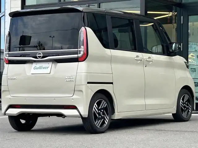 日産 ルークス ハイウェイスター X 愛媛県 2024(令6)年 0.9万km フローズンバニラパール/アッシュブラウンM 純正9型ナビ/全周囲カメラ/両側電動スライドドア/左側ハンズフリースライド/インテリジェントルームミラー/セーフティシールド/衝突被害軽減装置/車線逸脱防止装置/クリアランスソナー/リアサーキュレーター/後席サンシェイド/LEDヘッドライト/アイドリングストップ/ステアリングリモコン/電格ミラー/ヘッドライトレベライザー/シガーソケット/現状サマー(純正AW)(155/65/R14)/BRIDGESTONE EcoPia/禁煙車