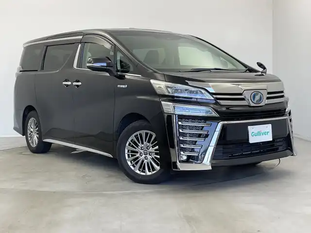 トヨタ ヴェルファイア ハイブリット ZR Gエディション 新潟県 2018(平30)年 6.4万km バーニングブラッククリスタルシャインガラスフレーク 禁煙車/４WD/純正メモリナビ/（BT/FM/AM/フルセグTV)/バック・フロントカメラ/ステアリングスイッチ/ステアリングヒーター/レザーシート/パワーシート/シートヒーター/ベンチレーション/オットマン/ドライブレコーダー/フリップダウンモニター/サンルーフ/純正LEDオートヘッドライト/サンシェード/電格ミラー/シーケンシャルウィンカー/ウィンカーミラー/ETC/取扱説明書
