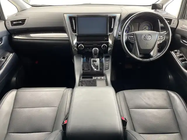 トヨタ ヴェルファイア ハイブリット ZR Gエディション 新潟県 2018(平30)年 6.4万km バーニングブラッククリスタルシャインガラスフレーク 禁煙車/４WD/純正メモリナビ/（BT/FM/AM/フルセグTV)/バック・フロントカメラ/ステアリングスイッチ/ステアリングヒーター/レザーシート/パワーシート/シートヒーター/ベンチレーション/オットマン/ドライブレコーダー/フリップダウンモニター/サンルーフ/純正LEDオートヘッドライト/サンシェード/電格ミラー/シーケンシャルウィンカー/ウィンカーミラー/ETC/取扱説明書