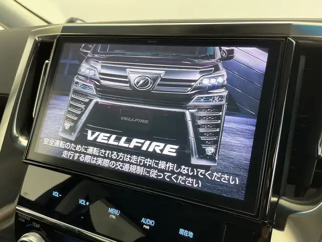 トヨタ ヴェルファイア ハイブリット ZR Gエディション 新潟県 2018(平30)年 6.4万km バーニングブラッククリスタルシャインガラスフレーク 禁煙車/４WD/純正メモリナビ/（BT/FM/AM/フルセグTV)/バック・フロントカメラ/ステアリングスイッチ/ステアリングヒーター/レザーシート/パワーシート/シートヒーター/ベンチレーション/オットマン/ドライブレコーダー/フリップダウンモニター/サンルーフ/純正LEDオートヘッドライト/サンシェード/電格ミラー/シーケンシャルウィンカー/ウィンカーミラー/ETC/取扱説明書