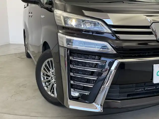 トヨタ ヴェルファイア ハイブリット ZR Gエディション 新潟県 2018(平30)年 6.4万km バーニングブラッククリスタルシャインガラスフレーク 禁煙車/４WD/純正メモリナビ/（BT/FM/AM/フルセグTV)/バック・フロントカメラ/ステアリングスイッチ/ステアリングヒーター/レザーシート/パワーシート/シートヒーター/ベンチレーション/オットマン/ドライブレコーダー/フリップダウンモニター/サンルーフ/純正LEDオートヘッドライト/サンシェード/電格ミラー/シーケンシャルウィンカー/ウィンカーミラー/ETC/取扱説明書