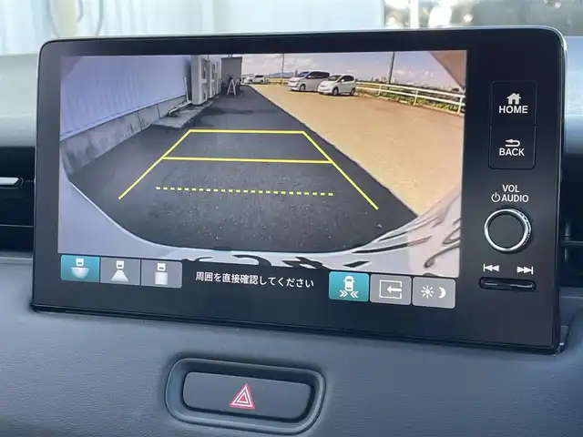ホンダ ヴェゼル ハイブリッド e:HEV Z 佐賀県 2025(令7)年 0.1千km プラチナホワイトパール 登録済未使用車/DN登録時走行距離２ｋｍ/純正9型ナビゲーション/・AM/FM/BT//・Appple Car Play/Android Auto//・バックカメラ/ブラインドスポットモニター/パワーバックドア/純正18インチアルミホイール/ハーフレザーシート/シートヒーター「運転席/助手席」/アダプティブLEDヘッドライト/スマートキー/・スペアキー1本/ビルトインETC2.0/ホンダセンシング/・衝突軽減ブレーキ/・踏み間違え衝突軽減システム/・歩行者事故低減ステアリング /・車線維持支援システム/・アダプティブ・クルーズ・コントロール/・渋滞運転支援機能/・先行車発進お知らせ機能 /・標識認識機能/・ヒルスタートアシスト