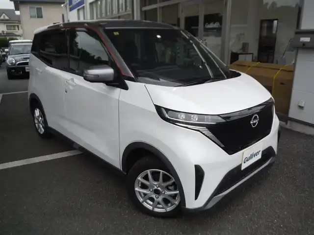 日産 サクラ G 東京都 2023(令5)年 0.4万km パールⅡ ワンオーナー車/保証書・取説あり/純正ナビ・TV・BLUETOOTH/　ビルトイン2.0ETC /　アラウンドビューモニター/　ドライブレコーダー前後/プロパイロット/　クルーズコントロール/　エマージェンシーブレーキ/　レーンキープアシスト/LEDヘッドライト/シートヒーター/ステアリングヒーター/インテリキー×2個/純正AWサマータイヤ8部山車内/充電ケーブル車内