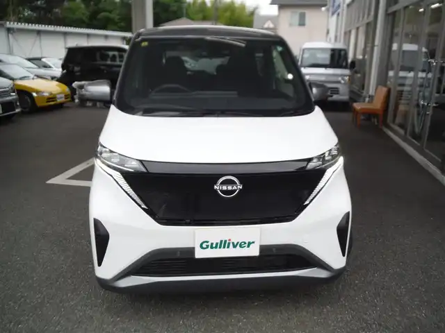 日産 サクラ G 東京都 2023(令5)年 0.4万km パールⅡ ワンオーナー車/保証書・取説あり/純正ナビ・TV・BLUETOOTH/　ビルトイン2.0ETC /　アラウンドビューモニター/　ドライブレコーダー前後/プロパイロット/　クルーズコントロール/　エマージェンシーブレーキ/　レーンキープアシスト/LEDヘッドライト/シートヒーター/ステアリングヒーター/インテリキー×2個/純正AWサマータイヤ8部山車内/充電ケーブル車内