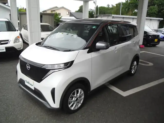 日産 サクラ G 東京都 2023(令5)年 0.4万km パールⅡ ワンオーナー車/保証書・取説あり/純正ナビ・TV・BLUETOOTH/　ビルトイン2.0ETC /　アラウンドビューモニター/　ドライブレコーダー前後/プロパイロット/　クルーズコントロール/　エマージェンシーブレーキ/　レーンキープアシスト/LEDヘッドライト/シートヒーター/ステアリングヒーター/インテリキー×2個/純正AWサマータイヤ8部山車内/充電ケーブル車内