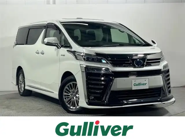 トヨタ ヴェルファイア ハイブリット 大阪府 2020(令2)年 4.7万km ホワイトパールクリスタルシャイン 純正ナビ（DVD/CD/BT）/バックカメラ/ETC/スマートキー/4WD/デジタルインナーミラー/ブラインドスポットモニター/サンルーフ/TRDエアロ/両側パワースライドドア/ステアリングスイッチ/レーンキープアシスト/レーダークルーズコントロール/衝突被害軽減システム/Wオートエアコン/オートライト/オートハイビーム/オートワイパー/オートホールド/電子パーキング/パワーバックドア/前席パワーシート/前席シートヒーター/前席シートクーラー/ハンドルヒーター/前後ドライブレコーダー/純正アルミホイール/純正フロアマット