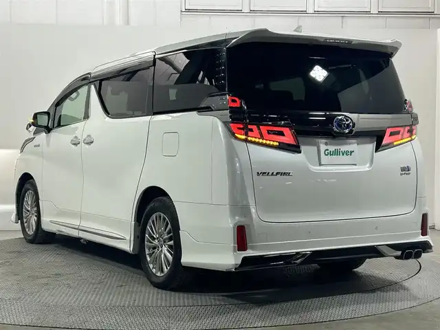 トヨタ ヴェルファイア ハイブリット 大阪府 2020(令2)年 4.7万km ホワイトパールクリスタルシャイン 純正ナビ（DVD/CD/BT）/バックカメラ/ETC/スマートキー/4WD/デジタルインナーミラー/ブラインドスポットモニター/サンルーフ/TRDエアロ/両側パワースライドドア/ステアリングスイッチ/レーンキープアシスト/レーダークルーズコントロール/衝突被害軽減システム/Wオートエアコン/オートライト/オートハイビーム/オートワイパー/オートホールド/電子パーキング/パワーバックドア/前席パワーシート/前席シートヒーター/前席シートクーラー/ハンドルヒーター/前後ドライブレコーダー/純正アルミホイール/純正フロアマット