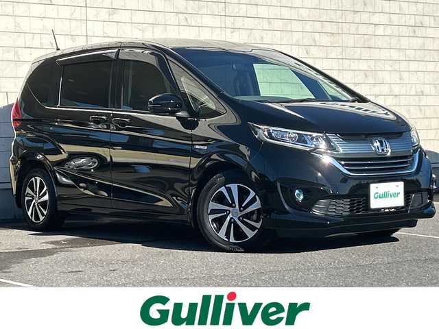 ホンダ フリード ハイブリット G ホンダセンシング 茨城県 2019(平31)年 6.7万km プレミアムスパークルブラックパール ALPINEナビ/後席フリップダウンモニター/(地デジTV・CD・DVD・BT・ラジオ再生)/両側パワースライドドア/レーダークルーズコントロール/レーンアシスト/衝突軽減ブレーキ/コーナーセンサー/ハーフレザーシート/バックカメラ/ETC/純正15inアルミホイール/純正フロアマット/スマートキー/取扱説明書/保証書