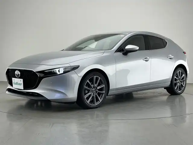 マツダ マツダ３ファストバック 20S バーガンディセレクション 愛知県 2019(令1)年 3万km ソニックシルバーM 純正８．８型ナビ　ＢＯＳＥサウンド　ＢＳＭ　禁煙　ＨＵＤ　赤革　ＨＤＭＩ　パドルシフト　追従クルコン　フルセグ　ＤＶＤ　パワーシート　シートヒーター　ＥＴＣ　ドラレコ　ＬＥＤライト　衝突軽減　コーナーセンサー　ステアリングヒーター　USB　Bluetooth　オートハイビーム　アイドリングストップ　プッシュスタート　スマートキー